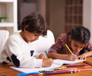 Tutor helping students with studies